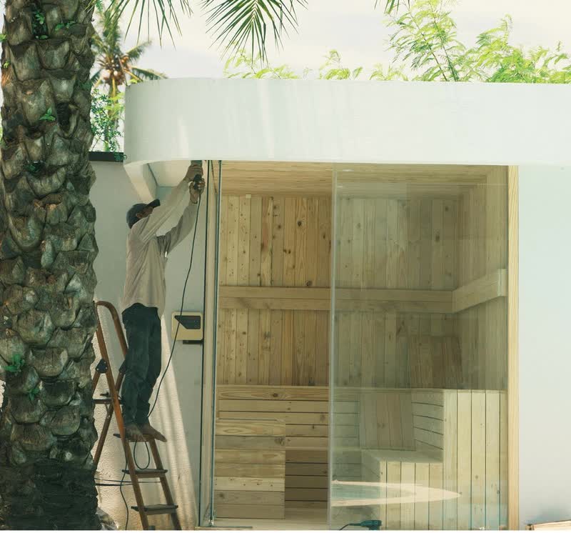 Hotel sauna glass cabin among palms in Bali