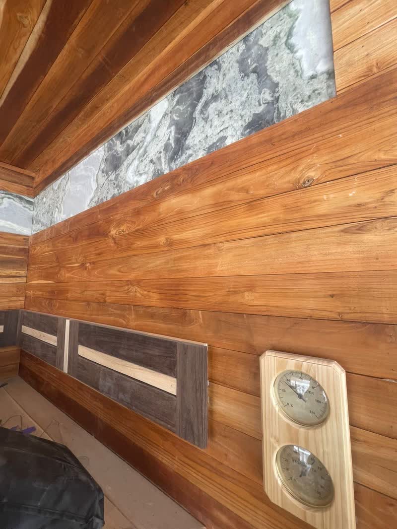Sauna timber cladding and stone wall detail with controls, Bali